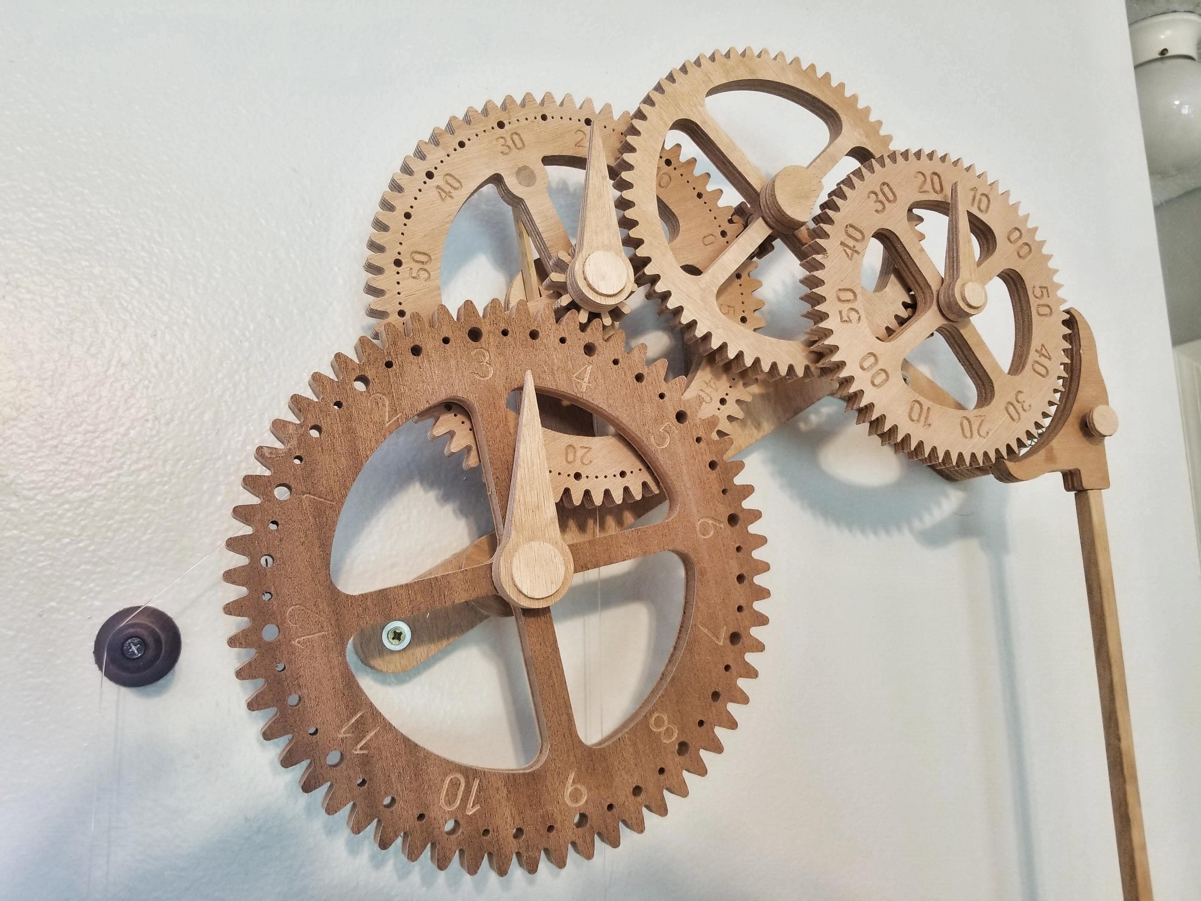 The wooden gear clock assembled and ticking.